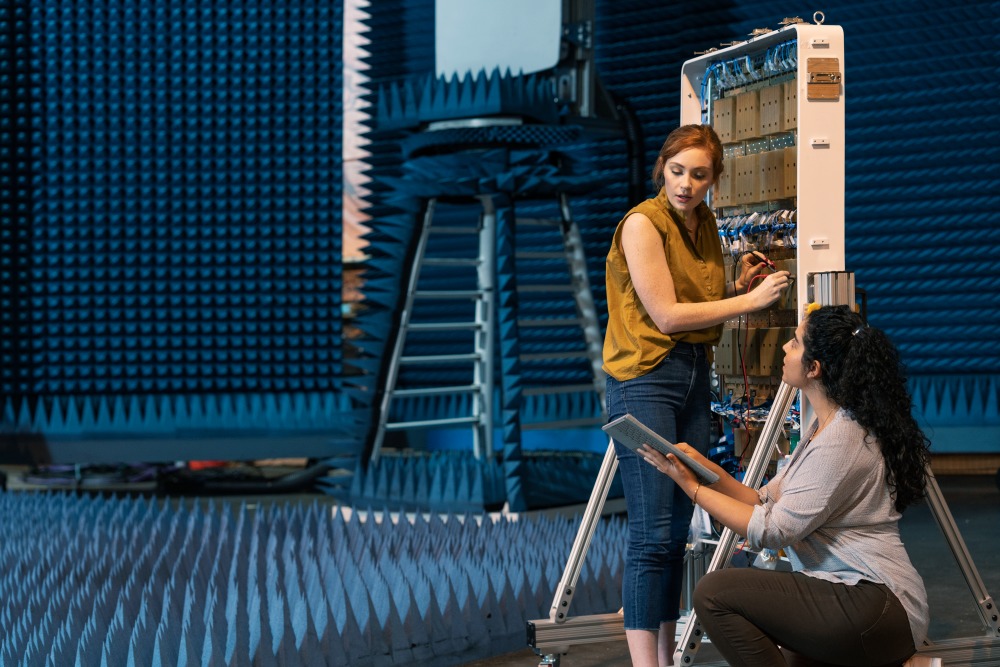 Engineers installing 5G antennas