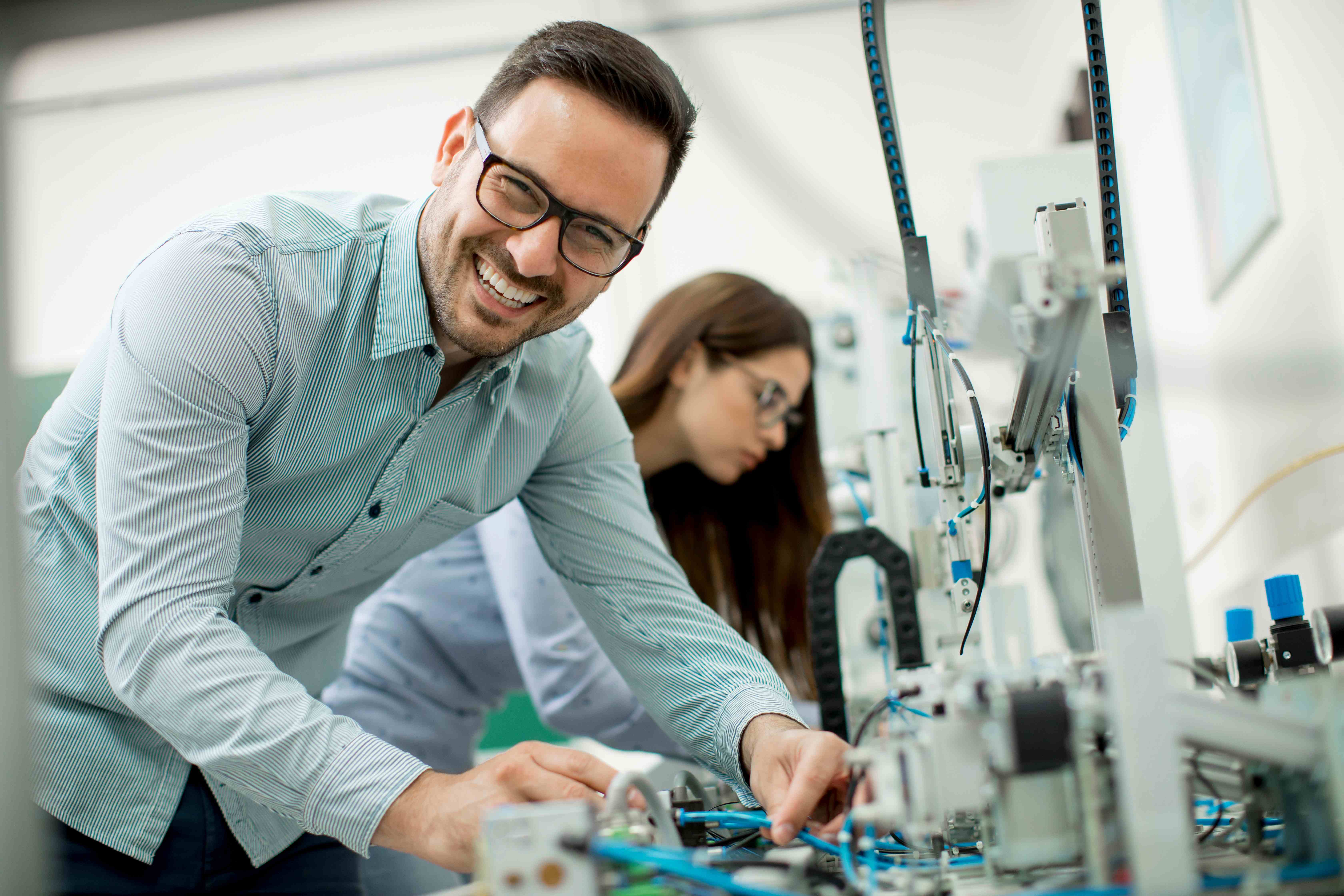 man in 5G lab smiling