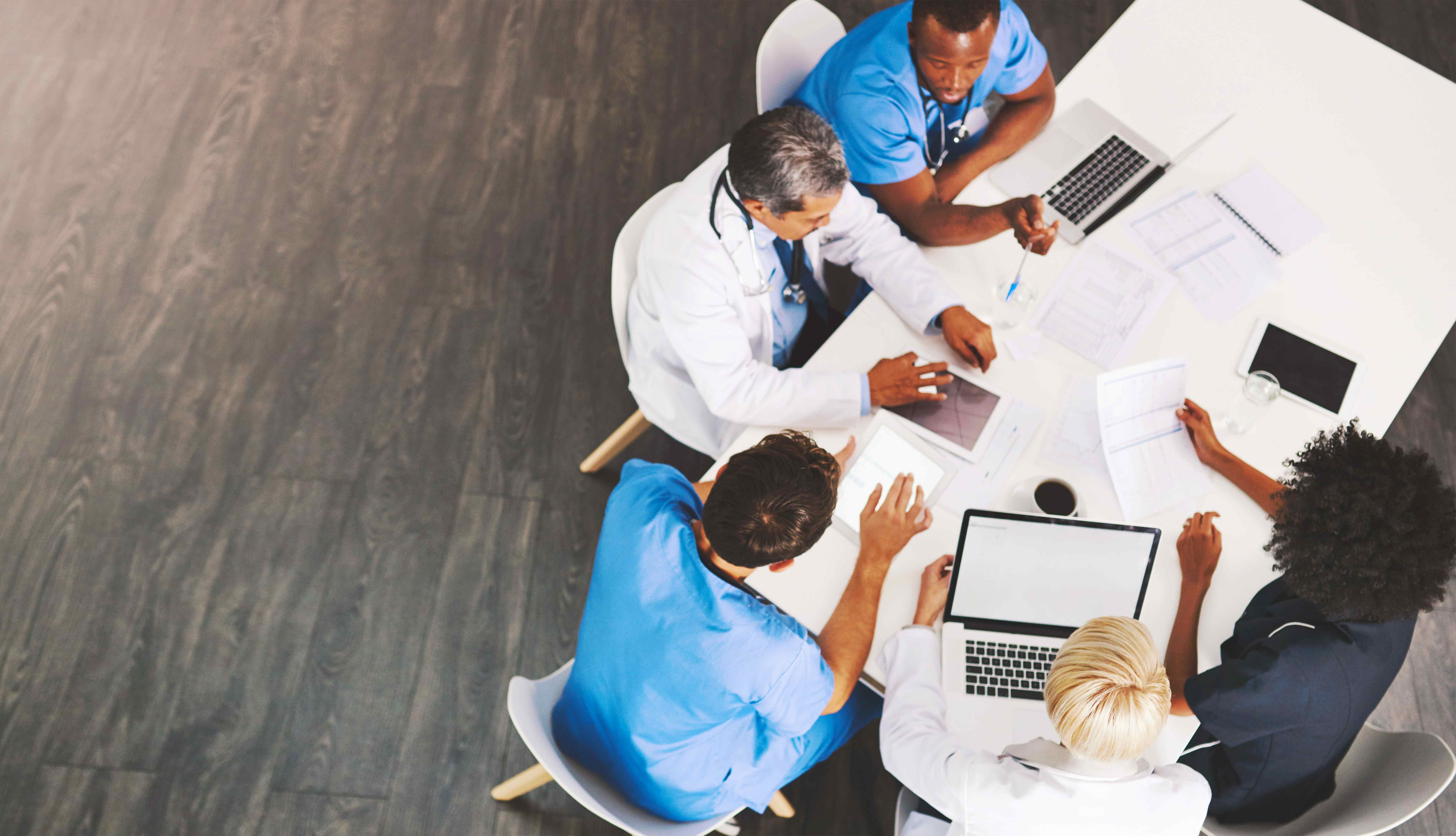 group at table studying log analysis for 5G